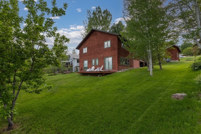 1763 Brome Dr, Steamboat Springs, CO 80487 - rear view of house featuring a wooden deck and a yard
