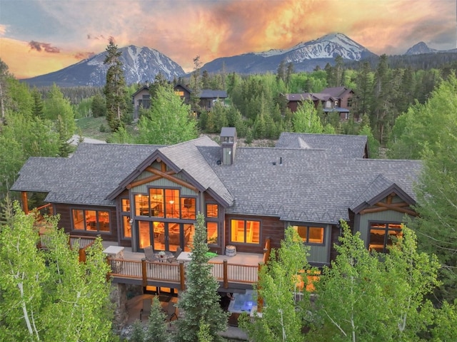 460 Two Cabins Dr, Silverthorne, CO 80498 - back of property at dusk with a deck with mountain view