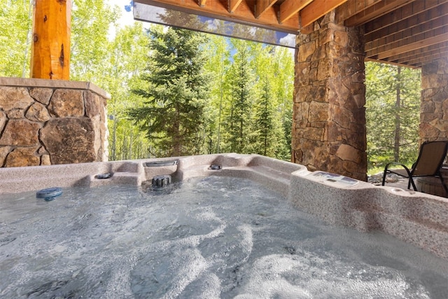 460 Two Cabins Dr, Silverthorne, CO 80498 - view of patio featuring a hot tub and a forest view