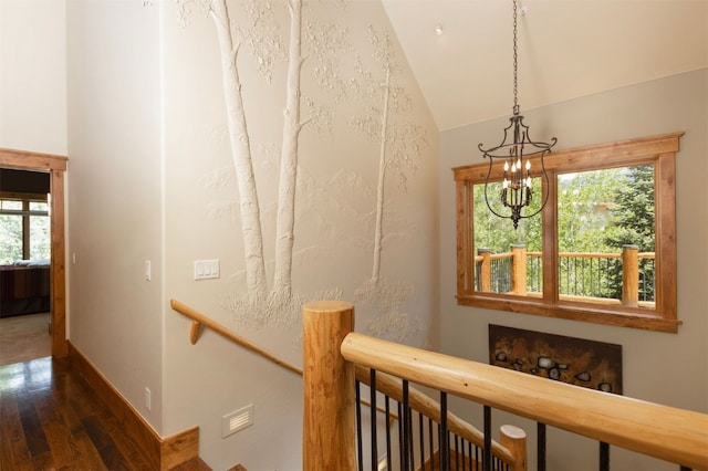 460 Two Cabins Dr, Silverthorne, CO 80498 - stairs featuring wood finished floors, a chandelier, healthy amount of natural light, and lofted ceiling