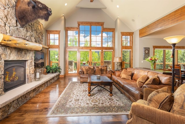 460 Two Cabins Dr, Silverthorne, CO 80498 - living room with high vaulted ceiling, plenty of natural light, a stone fireplace, wood finished floors, and recessed lighting