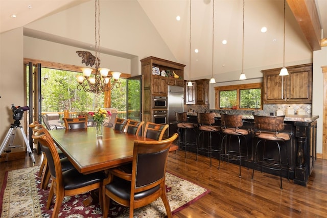 460 Two Cabins Dr, Silverthorne, CO 80498 - dining room with dark wood finished floors, a chandelier, high vaulted ceiling, and recessed lighting