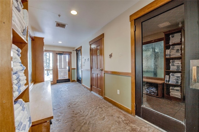 foyer entrance featuring recessed lighting, visible vents, and baseboards