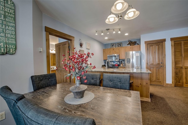 dining area featuring carpet