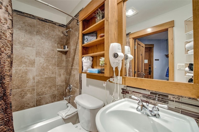 full bath featuring shower / bath combo, a sink, and toilet