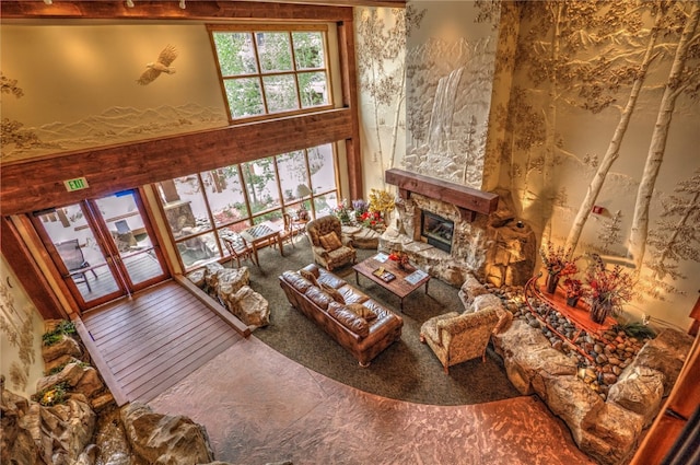 living room with a stone fireplace