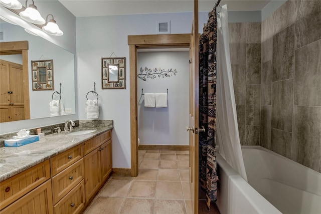 full bath with tile patterned floors, visible vents, toilet, vanity, and baseboards