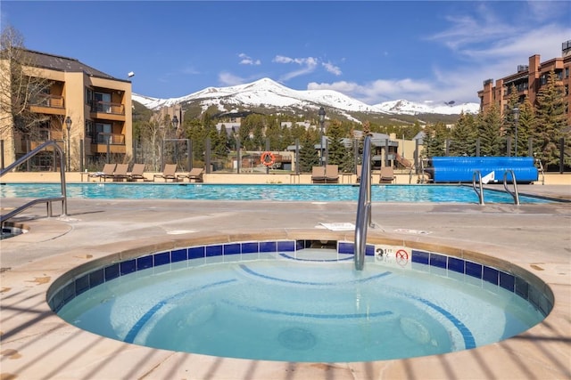 505 S Main St Unit 2207, Breckenridge, CO 80424 - community pool with a mountain view, a hot tub, and a patio