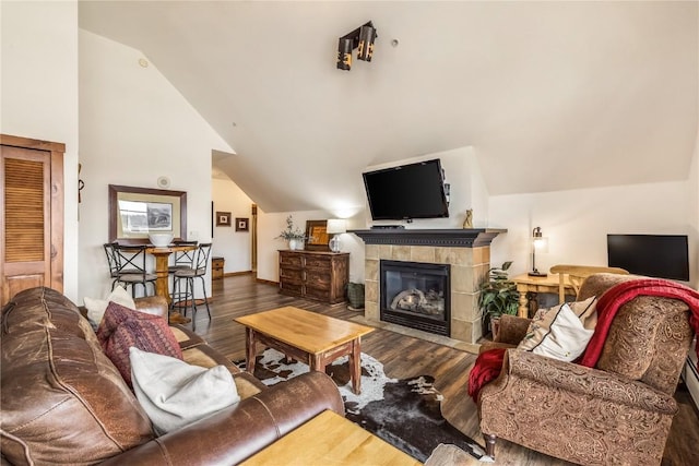 505 S Main St Unit 2207, Breckenridge, CO 80424 - living area with vaulted ceiling, wood finished floors, and a fireplace