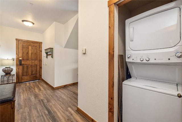 505 S Main St Unit 2207, Breckenridge, CO 80424 - laundry room featuring stacked washing machine and dryer, baseboards, and wood finished floors