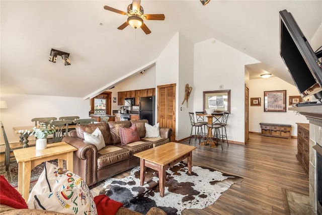 505 S Main St Unit 2207, Breckenridge, CO 80424 - living area featuring a fireplace with flush hearth, ceiling fan, wood finished floors, baseboards, and high vaulted ceiling