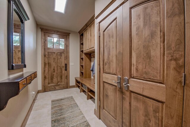 862 Penstemon Rd, Keystone, CO 80435 - mudroom featuring baseboards and light tile patterned floors
