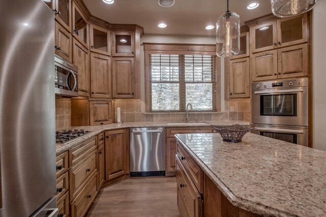 862 Penstemon Rd, Keystone, CO 80435 - kitchen with light stone countertops, stainless steel appliances, recessed lighting, and light wood finished floors
