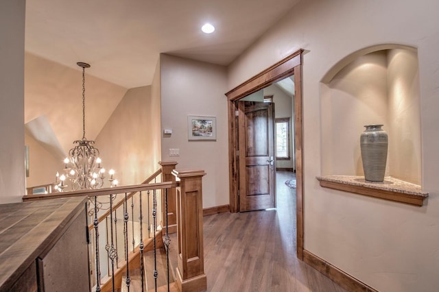 862 Penstemon Rd, Keystone, CO 80435 - corridor with recessed lighting, wood finished floors, an upstairs landing, baseboards, and a chandelier