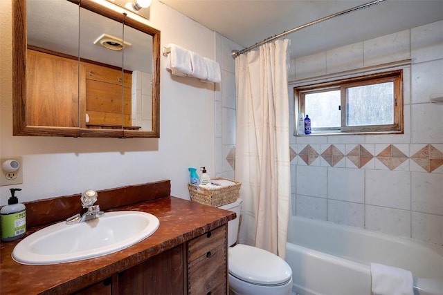 2180 Val Disere Cir, Steamboat Springs, CO 80487 - bathroom featuring vanity, toilet, and shower / tub combo with curtain