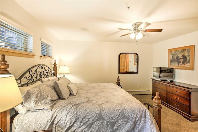 233 Creekside Dr Unit 104, Frisco, CO 80443 - carpeted bedroom with a baseboard heating unit and a ceiling fan