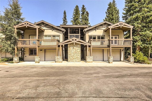233 Creekside Dr Unit 104, Frisco, CO 80443 - craftsman house with a balcony, stucco siding, and an attached garage