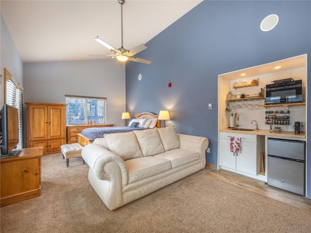 233 Creekside Dr Unit 104, Frisco, CO 80443 - bedroom featuring high vaulted ceiling, refrigerator, multiple windows, bar with sink, and ceiling fan