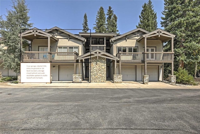 233 Creekside Dr Unit 104, Frisco, CO 80443 - craftsman-style house featuring a balcony, stucco siding, and an attached garage