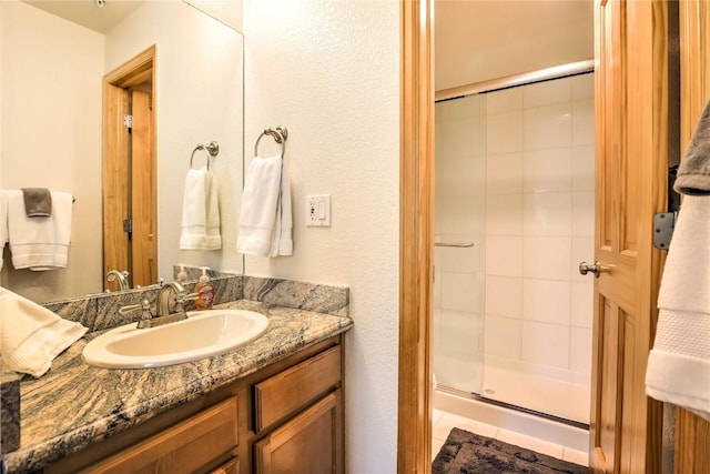 233 Creekside Dr Unit 104, Frisco, CO 80443 - full bathroom featuring a stall shower and vanity