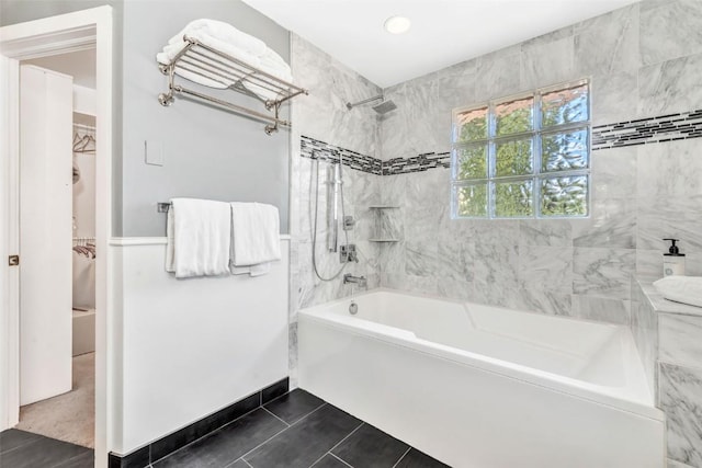 424 3rd St, Steamboat Springs, CO 80477 - bathroom with a walk in closet, tile patterned floors, and tub / shower combination