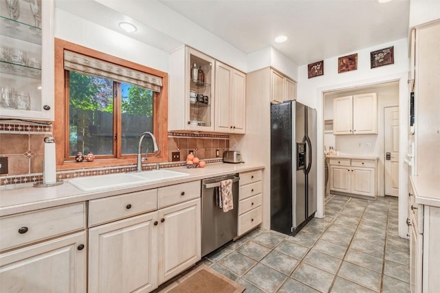 424 3rd St, Steamboat Springs, CO 80477 - kitchen with stainless steel appliances, a sink, tasteful backsplash, light countertops, and recessed lighting
