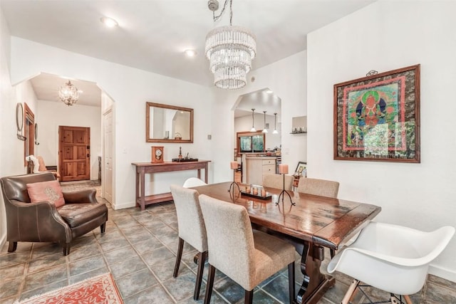 424 3rd St, Steamboat Springs, CO 80477 - dining space with arched walkways, a chandelier, and baseboards