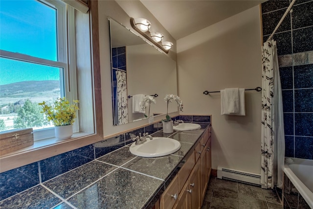 74 Stag Trl Unit 74, Dillon, CO 80435 - full bath with baseboard heating, double vanity, and tiled shower / bath