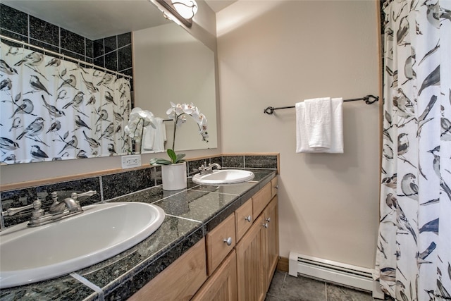 74 Stag Trl Unit 74, Dillon, CO 80435 - bathroom featuring a baseboard radiator, double vanity, a shower with curtain, and tile patterned flooring