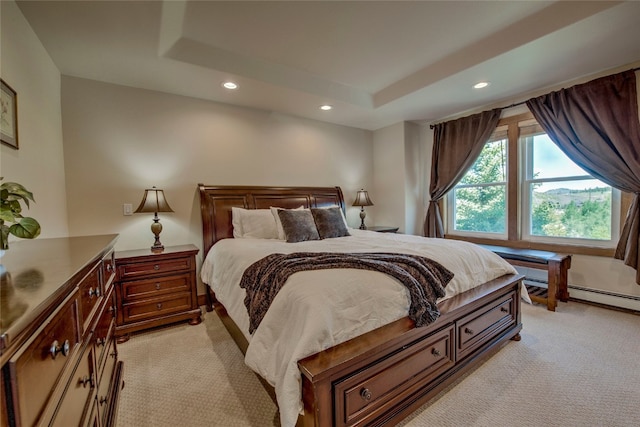 74 Stag Trl Unit 74, Dillon, CO 80435 - bedroom featuring light colored carpet, recessed lighting, a raised ceiling, and a baseboard radiator
