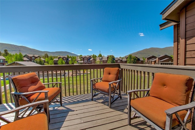 74 Stag Trl Unit 74, Dillon, CO 80435 - deck with a mountain view, a residential view, and a lawn