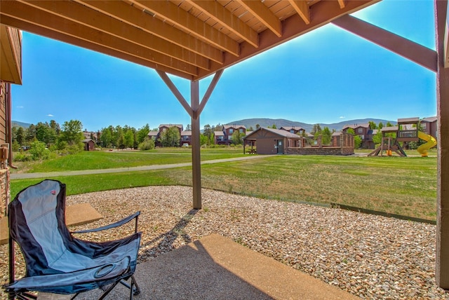 74 Stag Trl Unit 74, Dillon, CO 80435 - view of patio / terrace featuring a playground, a mountain view, and a residential view
