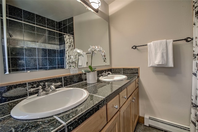 74 Stag Trl Unit 74, Dillon, CO 80435 - bathroom with a baseboard radiator, double vanity, and tiled shower