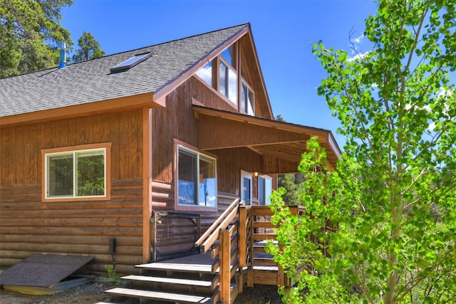 103 Foxtail Ct, Fairplay, CO 80440 - entrance to property with a shingled roof and faux log siding