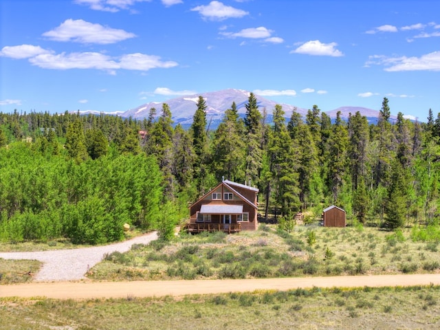 103 Foxtail Ct, Fairplay, CO 80440 - view of yard featuring a forest view, a storage shed, and a mountain view