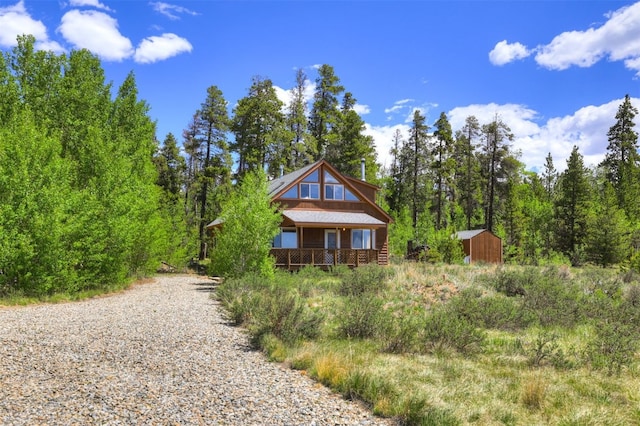 103 Foxtail Ct, Fairplay, CO 80440 - view of front of house featuring a shed and a wooded view