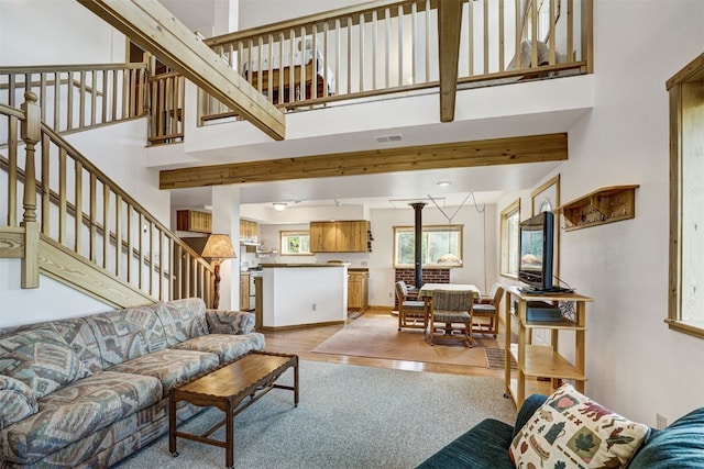 103 Foxtail Ct, Fairplay, CO 80440 - living area featuring a high ceiling, light wood finished floors, and stairs