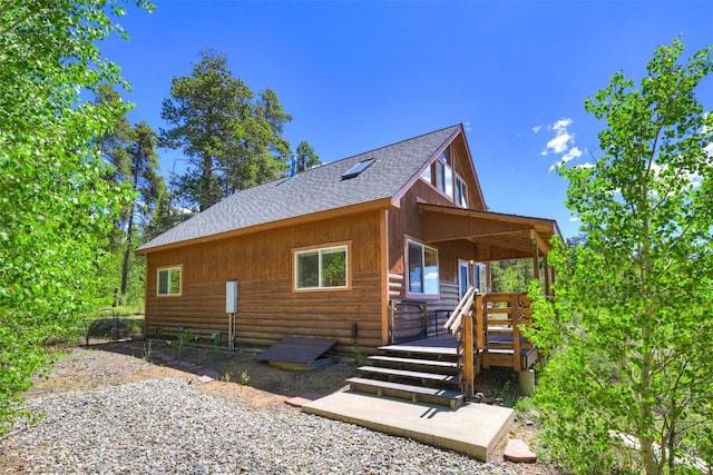 103 Foxtail Ct, Fairplay, CO 80440 - view of side of home with roof with shingles and a wooden deck