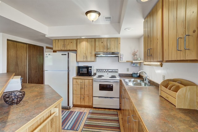 103 Foxtail Ct, Fairplay, CO 80440 - kitchen featuring white appliances, under cabinet range hood, dark countertops, light brown cabinets, and recessed lighting