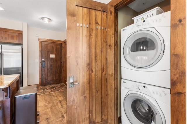 600 Columbine Rd Unit 5306, Breckenridge, CO 80424 - washroom with stacked washer / dryer and wood finished floors