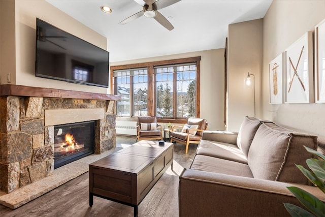 600 Columbine Rd Unit 5306, Breckenridge, CO 80424 - living room with wood finished floors, a ceiling fan, a fireplace, and recessed lighting