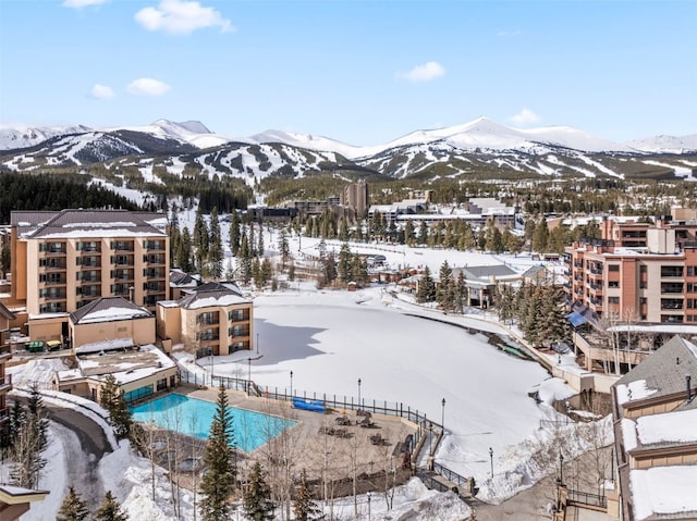 600 Columbine Rd Unit 5306, Breckenridge, CO 80424 - snowy aerial view with a mountain view and view of pool area