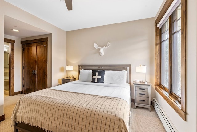 600 Columbine Rd Unit 5306, Breckenridge, CO 80424 - bedroom featuring light colored carpet, a baseboard heating unit, baseboards, and ceiling fan