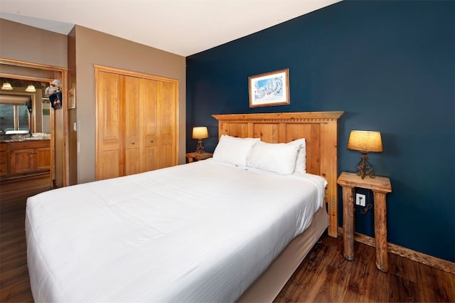 129 River Run Rd Unit 8040, Keystone, CO 80435 - bedroom featuring dark wood-type flooring, a closet, baseboards, and a sink