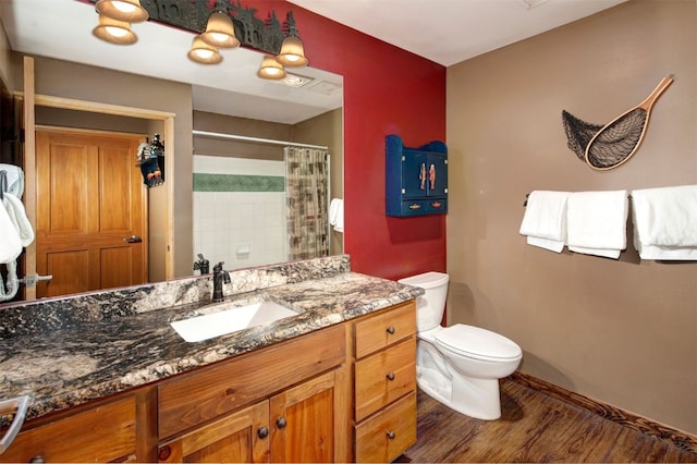 129 River Run Rd Unit 8040, Keystone, CO 80435 - full bath featuring toilet, vanity, wood finished floors, curtained shower, and baseboards