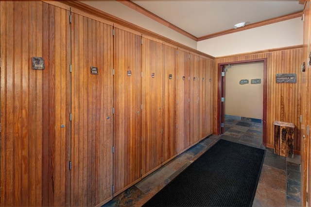 129 River Run Rd Unit 8040, Keystone, CO 80435 - corridor with crown molding, stone finish flooring, and wood walls