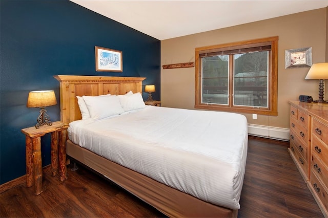 129 River Run Rd Unit 8040, Keystone, CO 80435 - bedroom with a baseboard heating unit, wood finished floors, and baseboards
