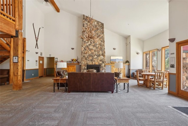 22714 US Highway 6 Unit 5941, Keystone, CO 80435 - living area featuring high vaulted ceiling, a stone fireplace, and beam ceiling