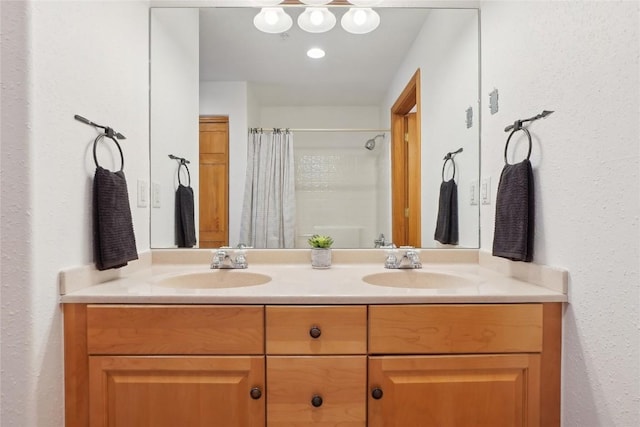 22714 US Highway 6 Unit 5941, Keystone, CO 80435 - bathroom featuring a sink, a shower with curtain, and double vanity