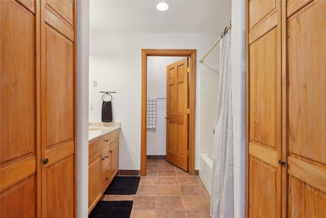 22714 US Highway 6 Unit 5941, Keystone, CO 80435 - bathroom with shower / bath combo, vanity, baseboards, tile patterned floors, and recessed lighting